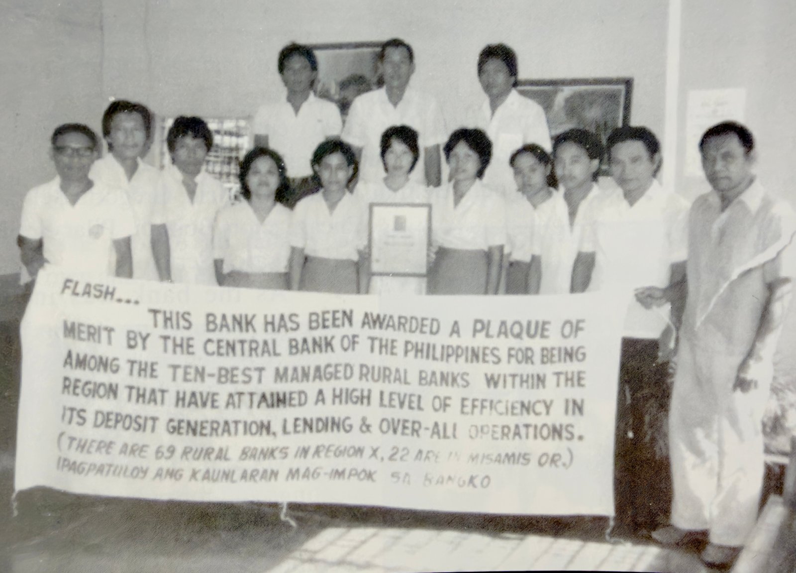 RBT Bank (formerly Rural Bank of Talisayan) staff receiving a Central Bank of the Philippines plaque of merit