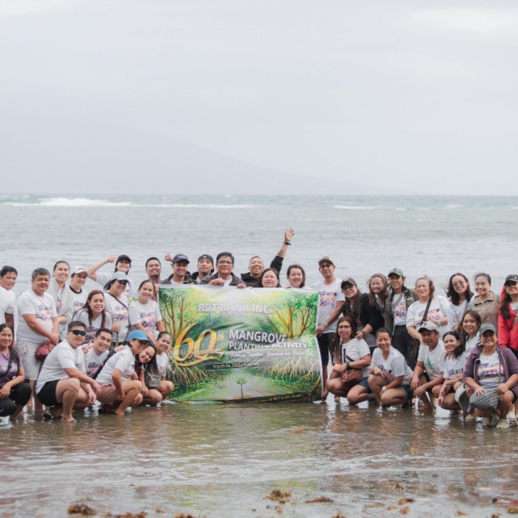RBT Bank Inc. staff and volunteers planting mangroves along the coast